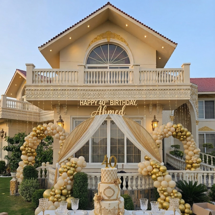 Elegant 40th birthday celebration setup at AH Royal Resort Islamabad with a luxury cake, golden décor, and a festive balloon arch for a family-friendly atmosphere.
