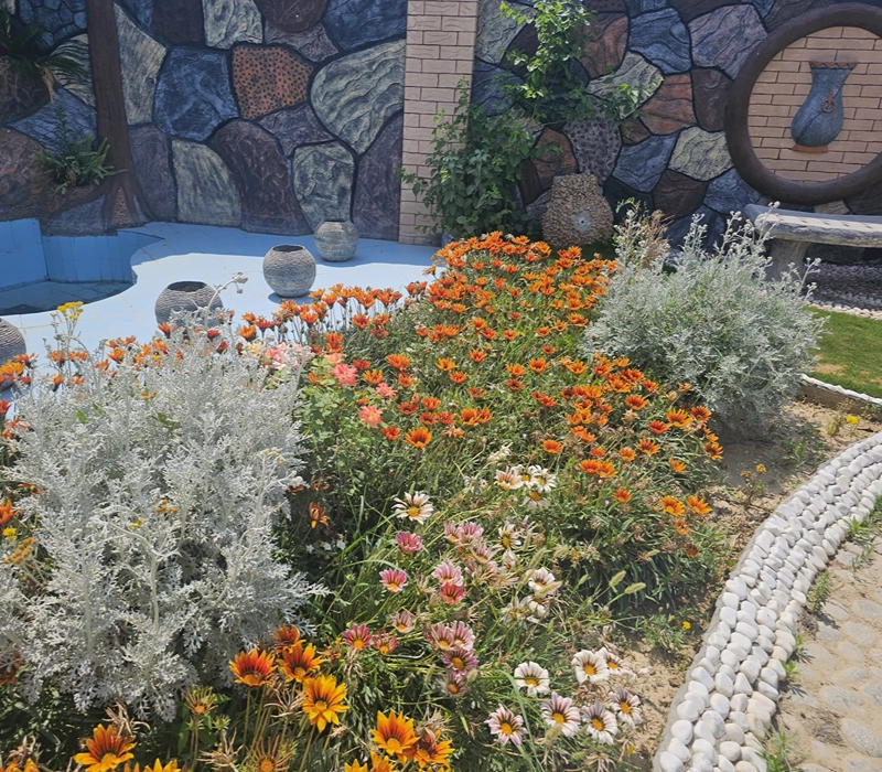 Beautiful landscaped gardens at a luxury farm house in Islamabad for rent with peaceful outdoor spaces near Islamabad Airport.
