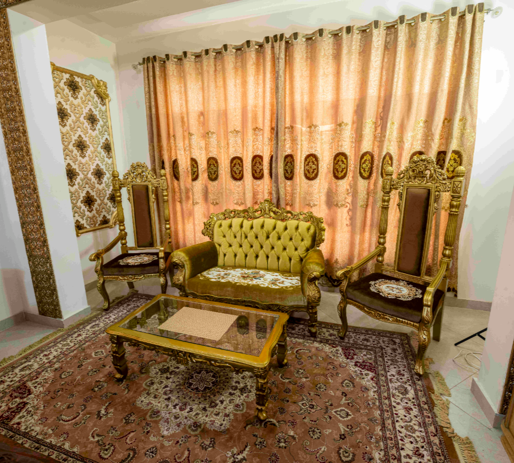 Luxury farmhouse sitting area near Islamabad featuring royal furniture, elegant dรฉcor, and premium indoor event ambiance