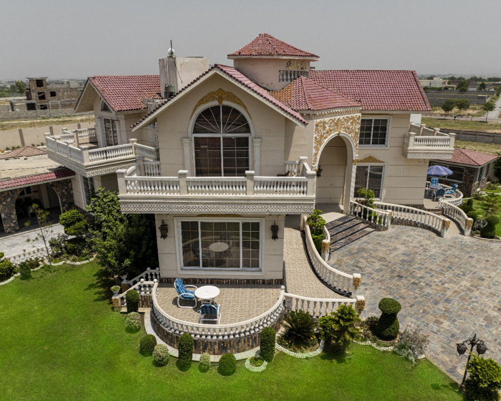 Luxury farmhouse exterior with terrace and garden, ideal private photoshoot venue in Islamabad with elegant architecture