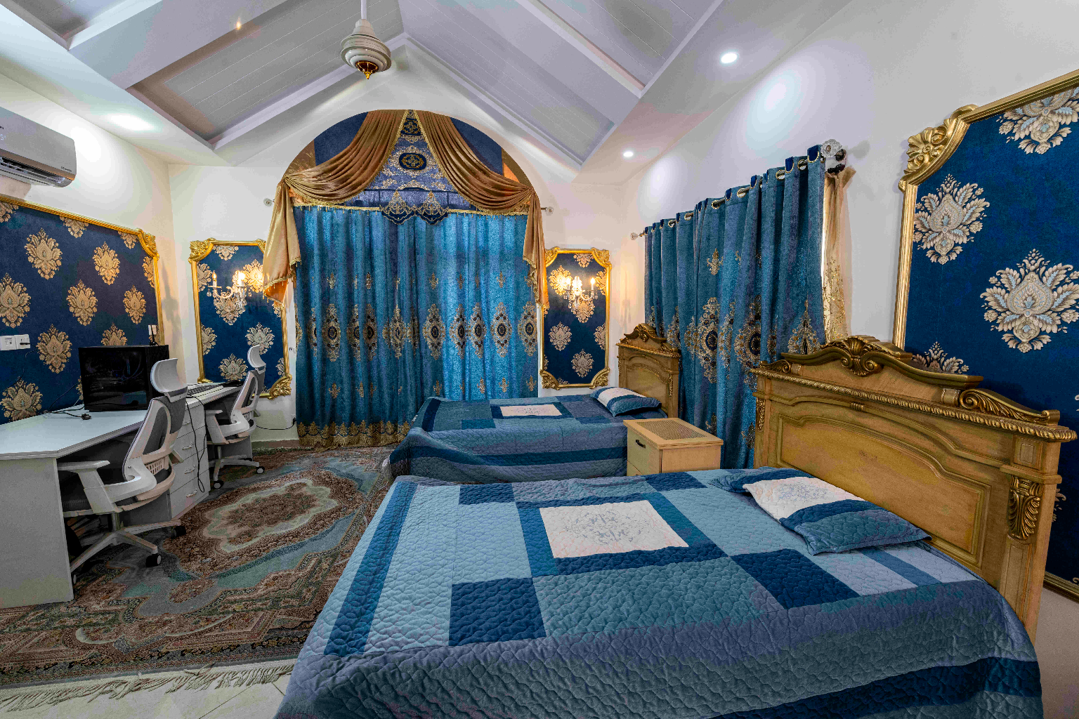 Luxury guest house room in Islamabad Pakistan for rent with twin beds, royal décor, workspace, and premium comfort