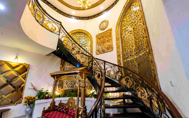 Grand staircase and elegant indoor décor creating a luxurious backdrop for stunning Mehndi photoshoot ideas in 2026