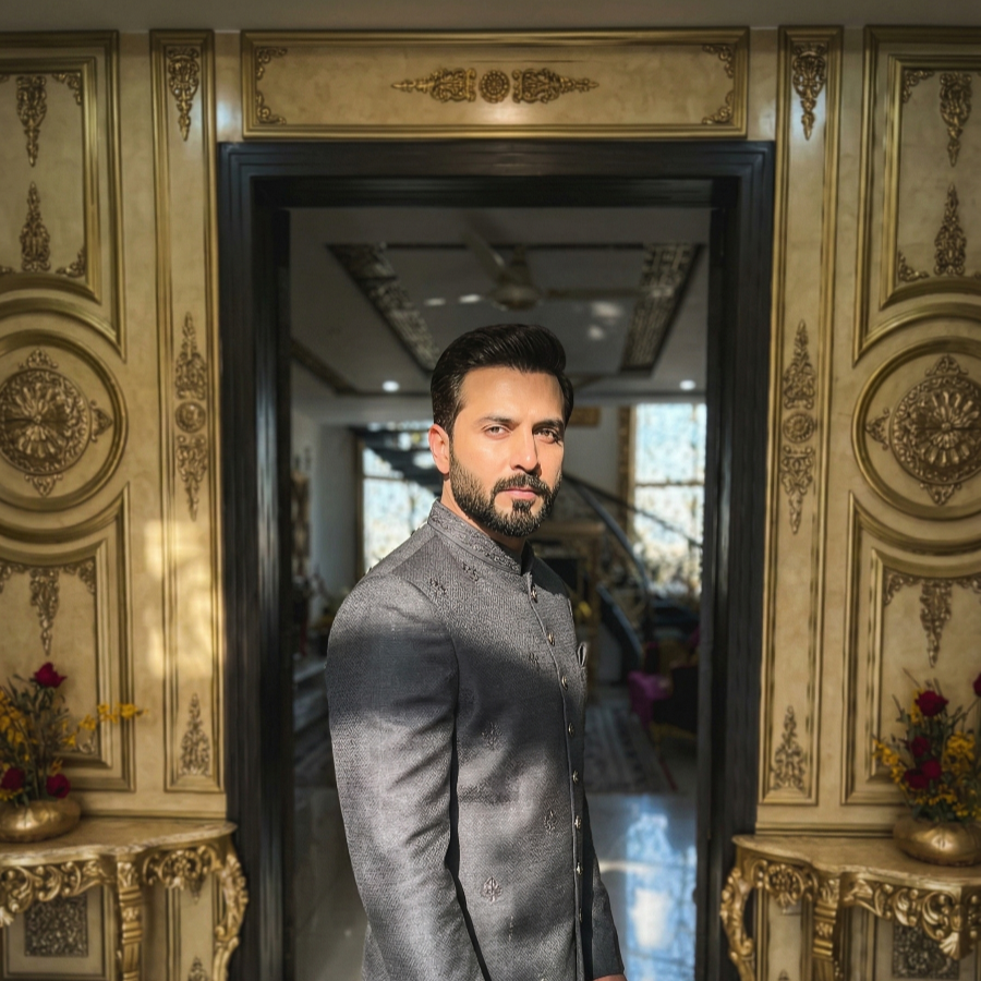 Man in traditional attire posing in luxury resort interior, elegant private photoshoot venue in Islamabad with premium dΓ©cor