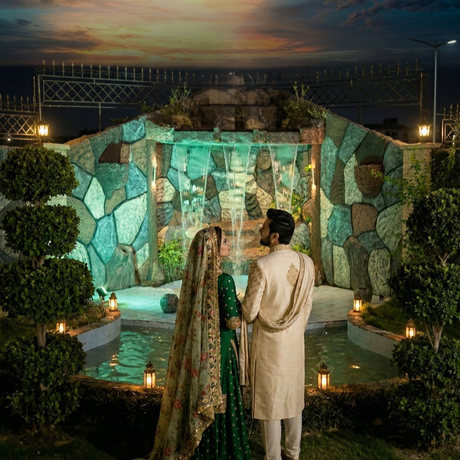 Couple at luxury farmhouse waterfall venue near Islamabad showcasing elegant outdoor wedding and event ambiance