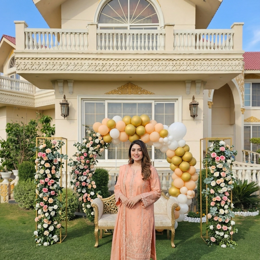 Elegant outdoor wedding photoshoot setup at a luxury farmhouse venue in Islamabad with floral décor and royal backdrop